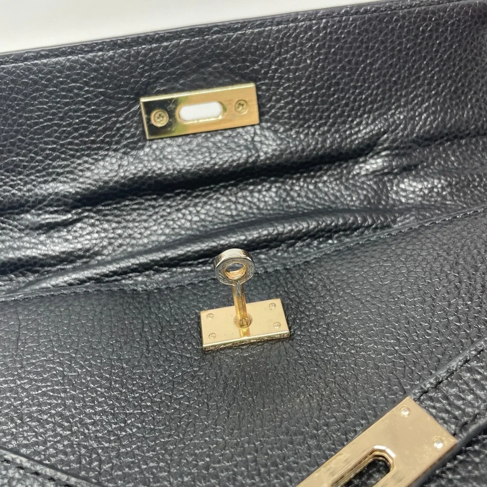 Zenith Black Pebbled Leather Clutch Bag Gold Turn Lock Hardware Handle Handbag